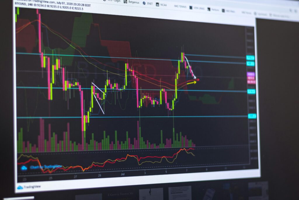 Close-up of a computer screen displaying cryptocurrency market trends and trading data.